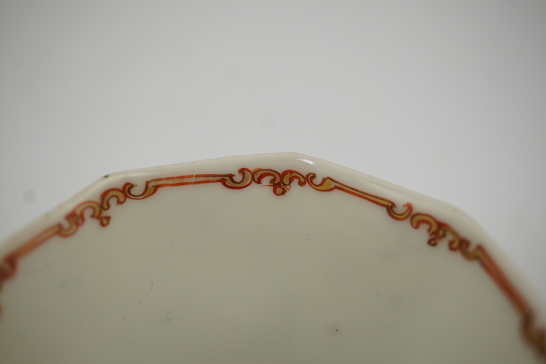 Two Chinese semi-eggshell porcelain hexagonal saucers and a similar cup, Yongzheng/Qianlong period
